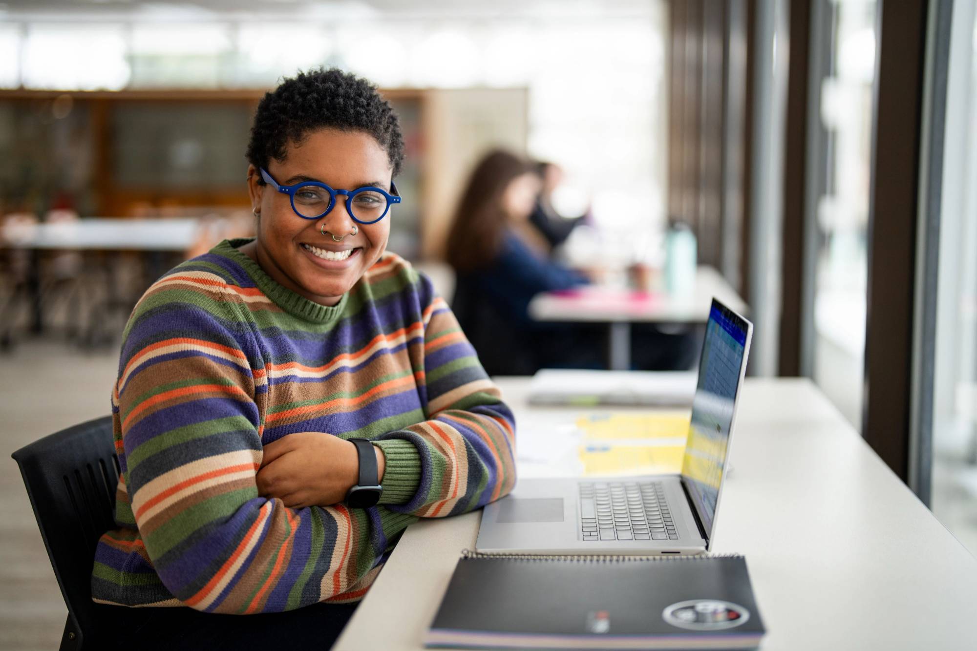 a GVSU adult student working in the Mary Idema Pew library